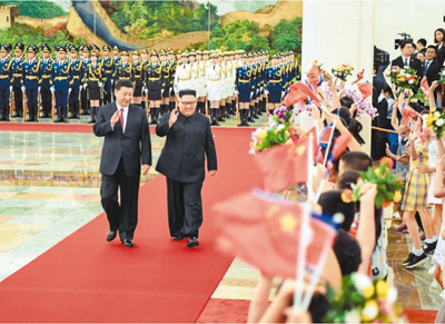 习近平同朝鲜劳动党委员长金正恩举行会谈