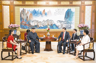 习近平会见朝鲜劳动党委员长金正恩